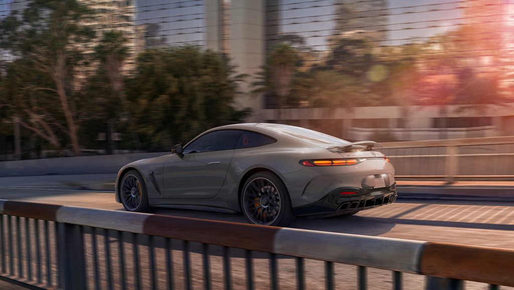 Mercedes-Benz coupe driving through a cityscape, representing how Section 179 tax benefits can apply to luxury vehicles.