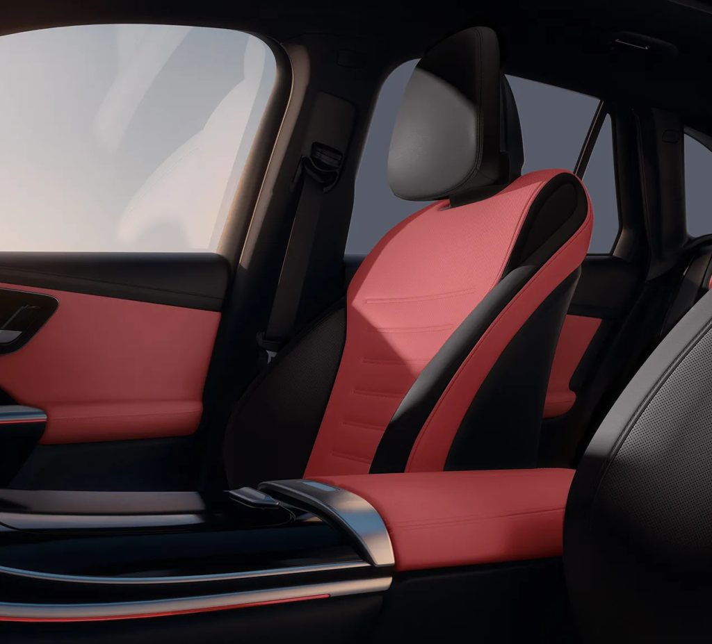 Interior of the 2026 Mercedes-Benz GLC featuring red and black leather seats and a modern console design focused on luxury and ergonomics.