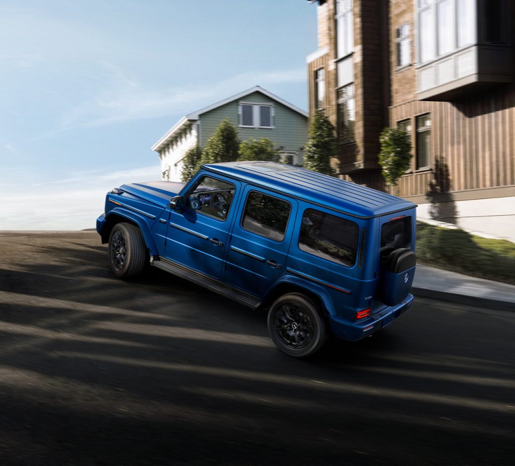 Blue Mercedes Baby G-Class driving uphill in a city, highlighting the compact G-Wagen’s agility and bold new chapter.