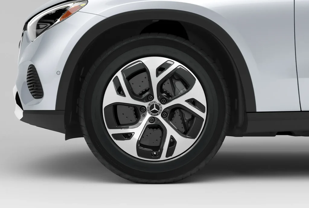 Close-up of a Mercedes-Benz winter tire inspection for safe driving in Chicago winter conditions.