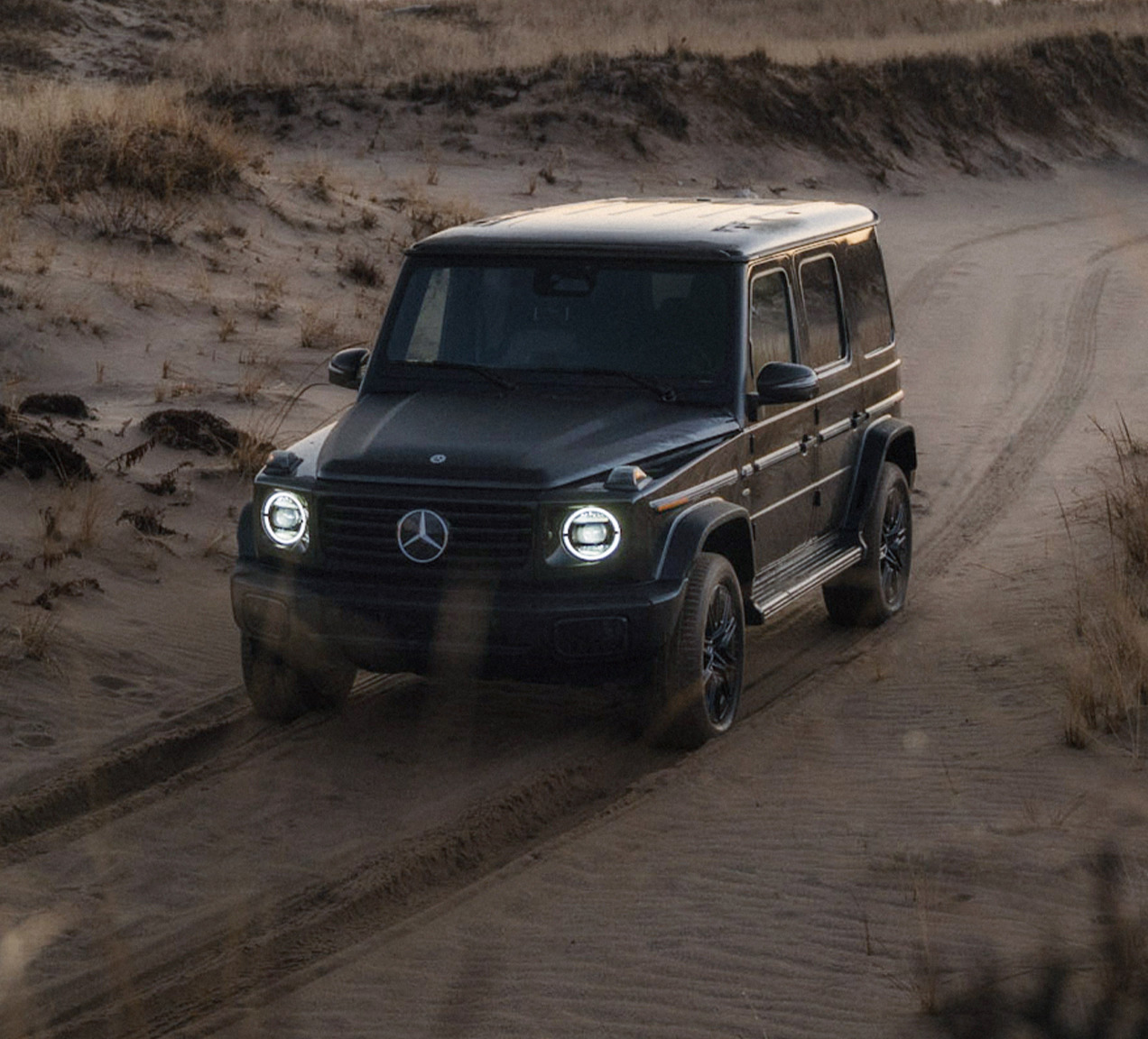 Upcoming Mini or Baby G-Wago driving on a sandy trail with rugged Mercedes-Benz styling