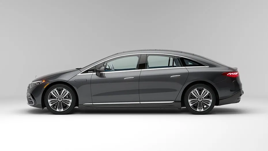 Side view of the Mercedes-Benz EQS showing its long, smooth, aerodynamic luxury sedan shape