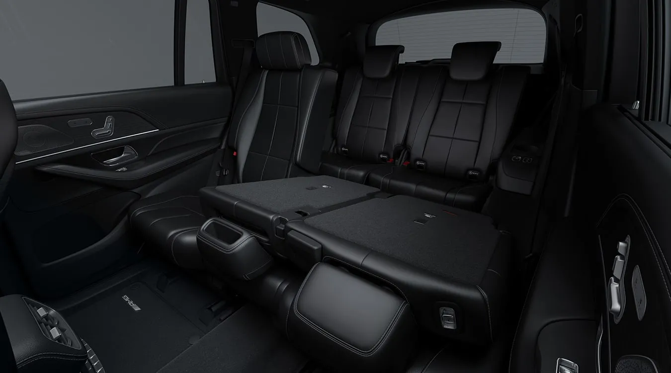 2027 Mercedes-Benz GLS rear cabin with black leather three-row seating and foldable second-row seats.