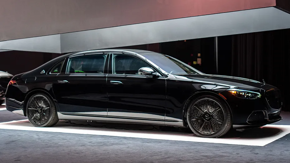 2027 Mercedes-Maybach S-Class black luxury sedan shown in side view with premium wheels and Maybach exterior details.