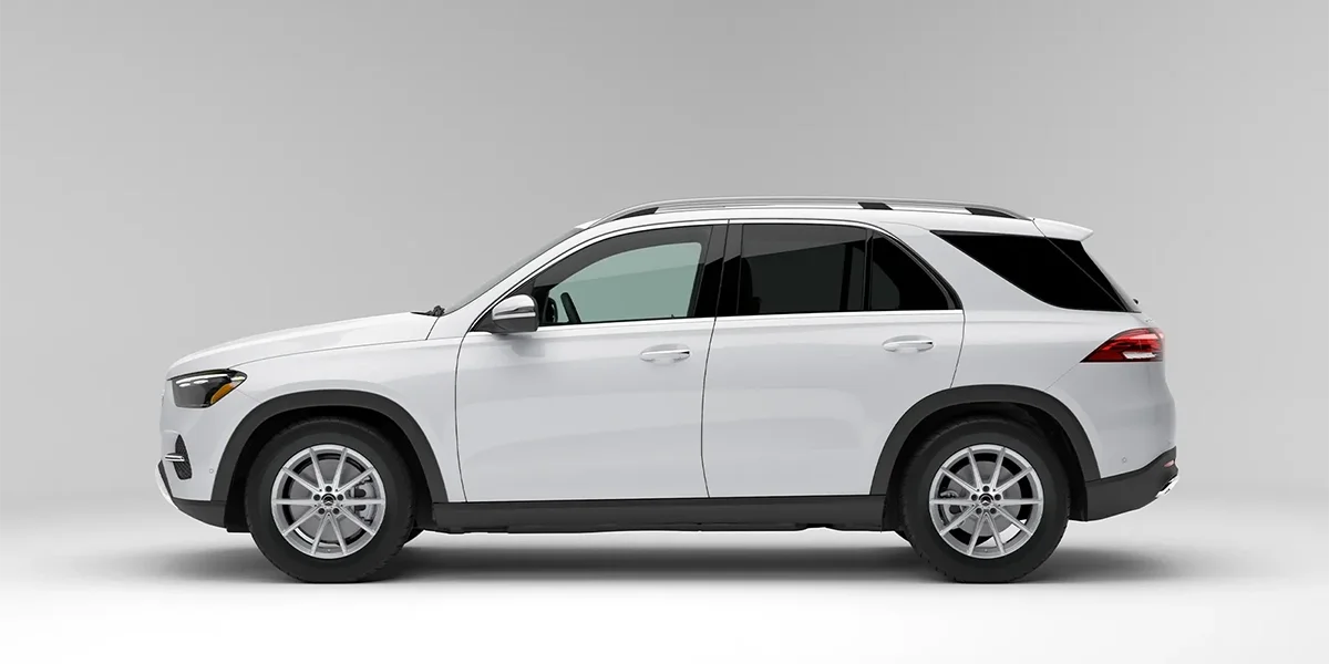 White Mercedes-Benz GLE shown in full side profile against a light background