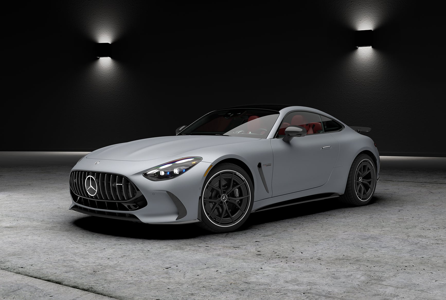 Silver 2027 Mercedes-Benz AMG GT 63 S E PERFORMANCE Coupe displayed in a dark studio.