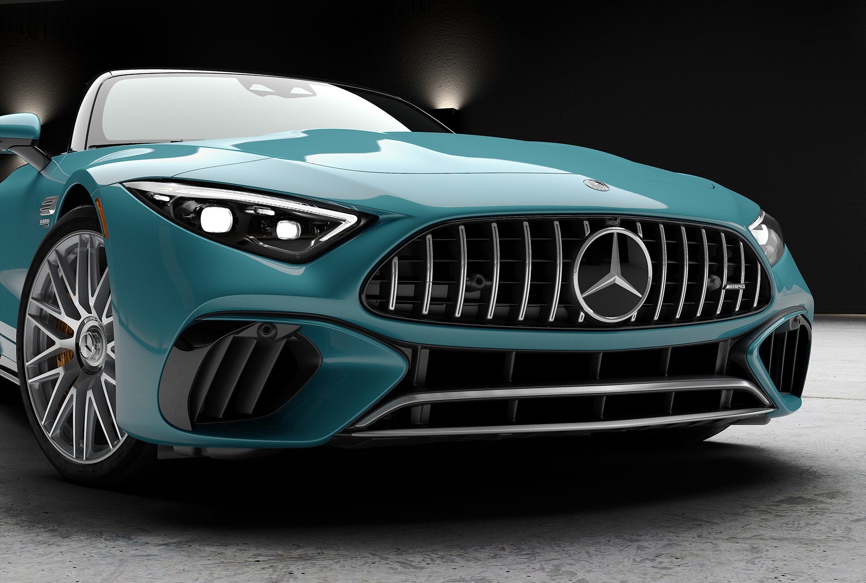 Front view of the turquoise 2027 Mercedes-Benz AMG SL 63 Roadster with an AMG grille.