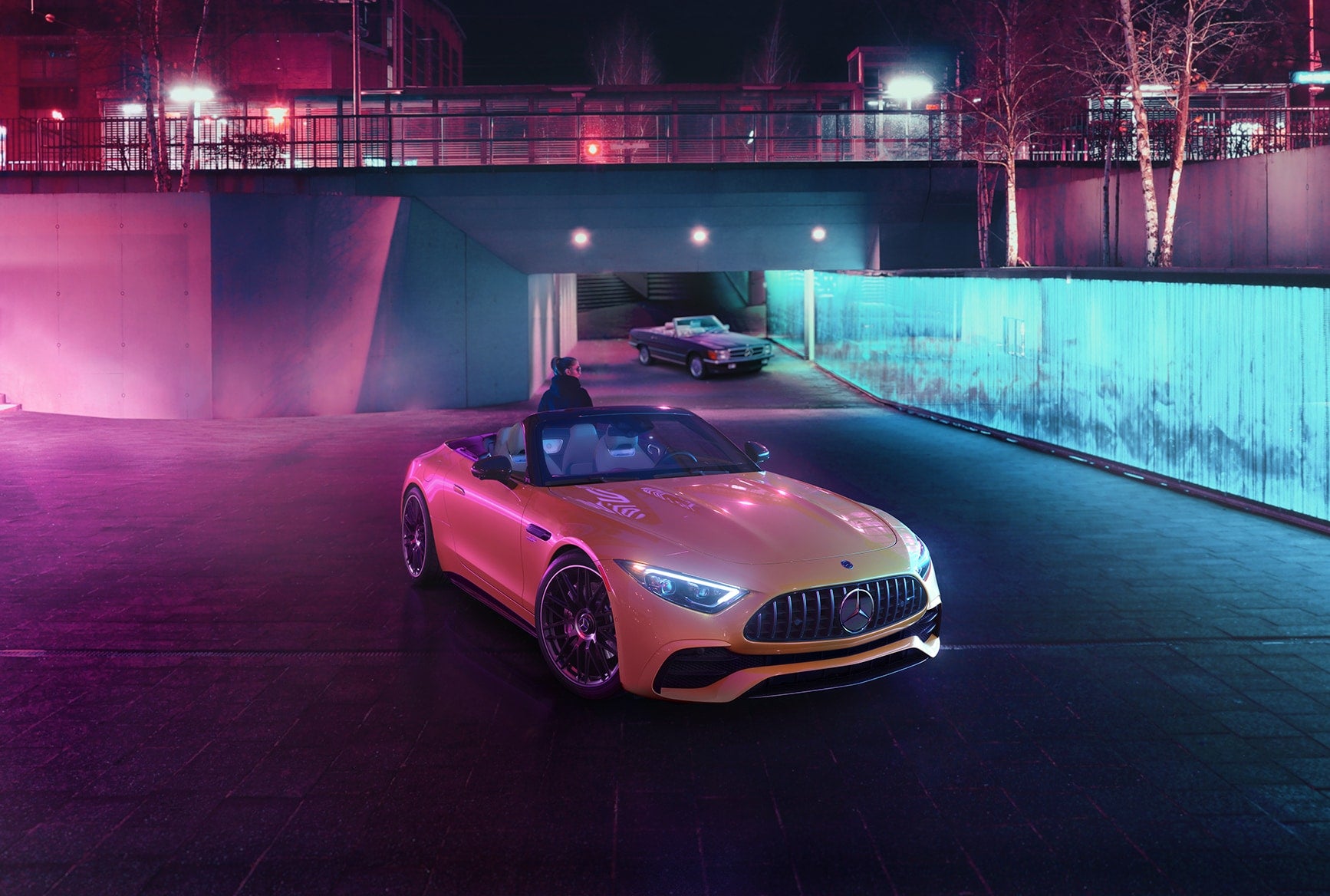 2027 Mercedes-Benz AMG SL 43 Roadster displayed at night with AMG performance styling