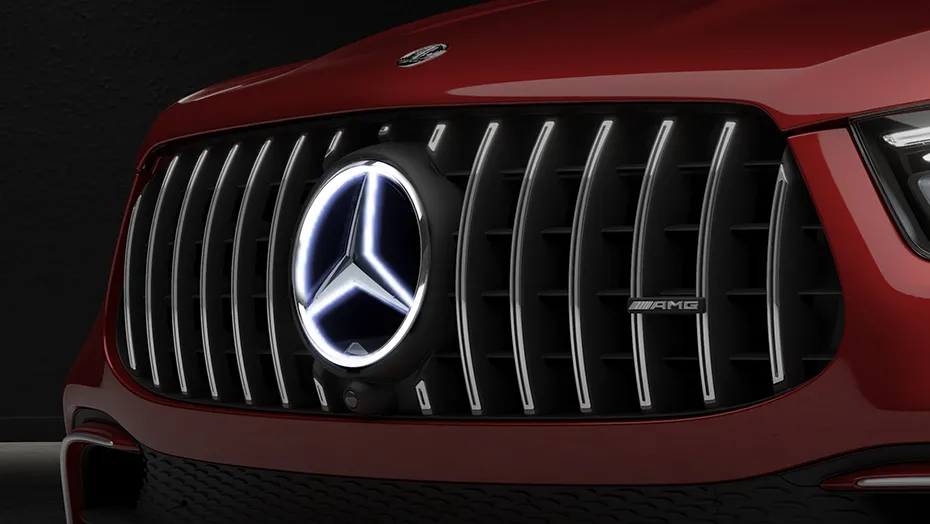 Close-up of the 2027 Mercedes-AMG GLE 63 S Coupe grille and illuminated Mercedes emblem.
