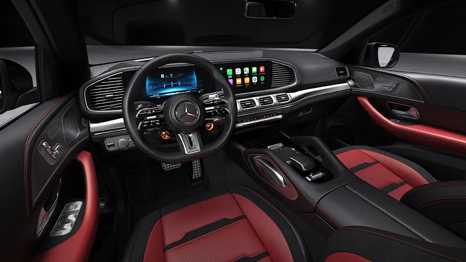 Red-and-black interior of the 2027 Mercedes-AMG GLE 63 S Coupe with AMG steering wheel and digital dashboard.
