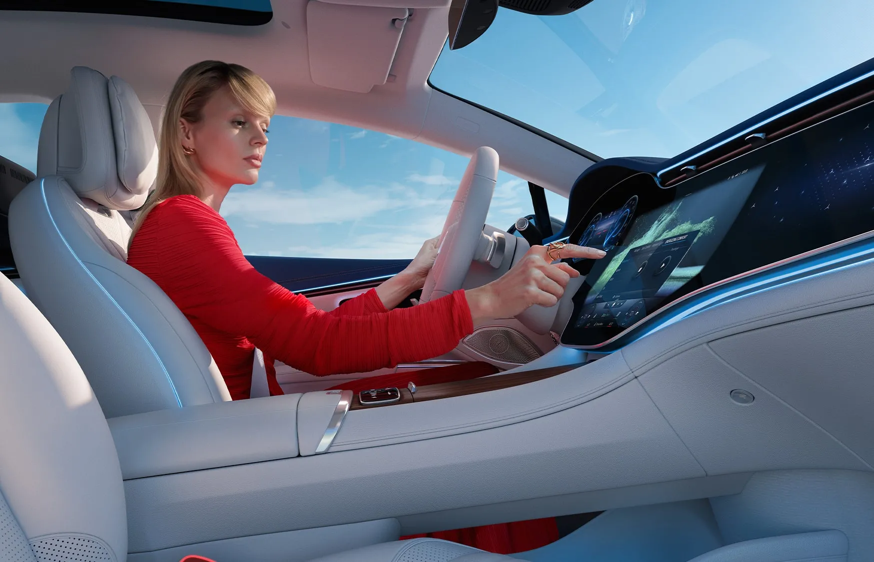 2027 Mercedes-Benz EQS Sedan driver using advanced electric performance touchscreen controls.