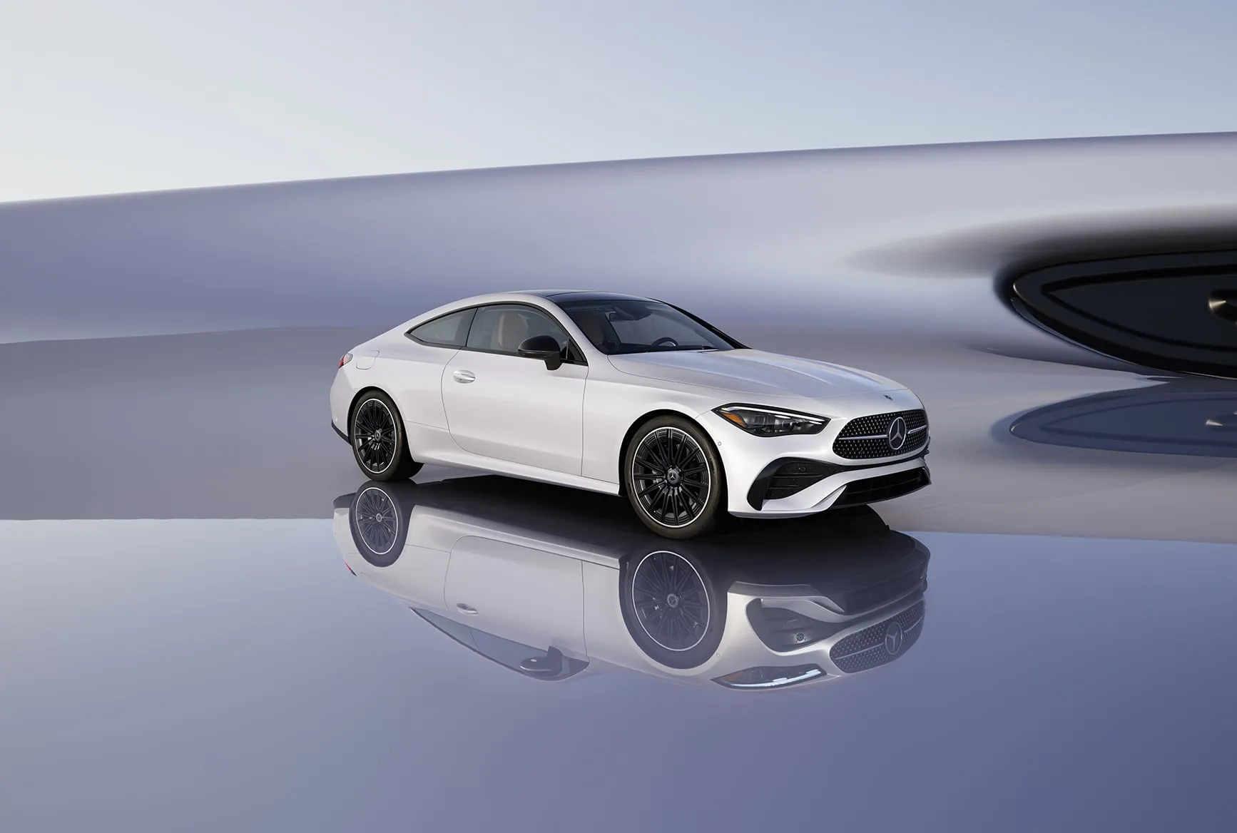 2027 Mercedes-Benz CLE Coupe white exterior with sporty wheels and elegant coupe profile.