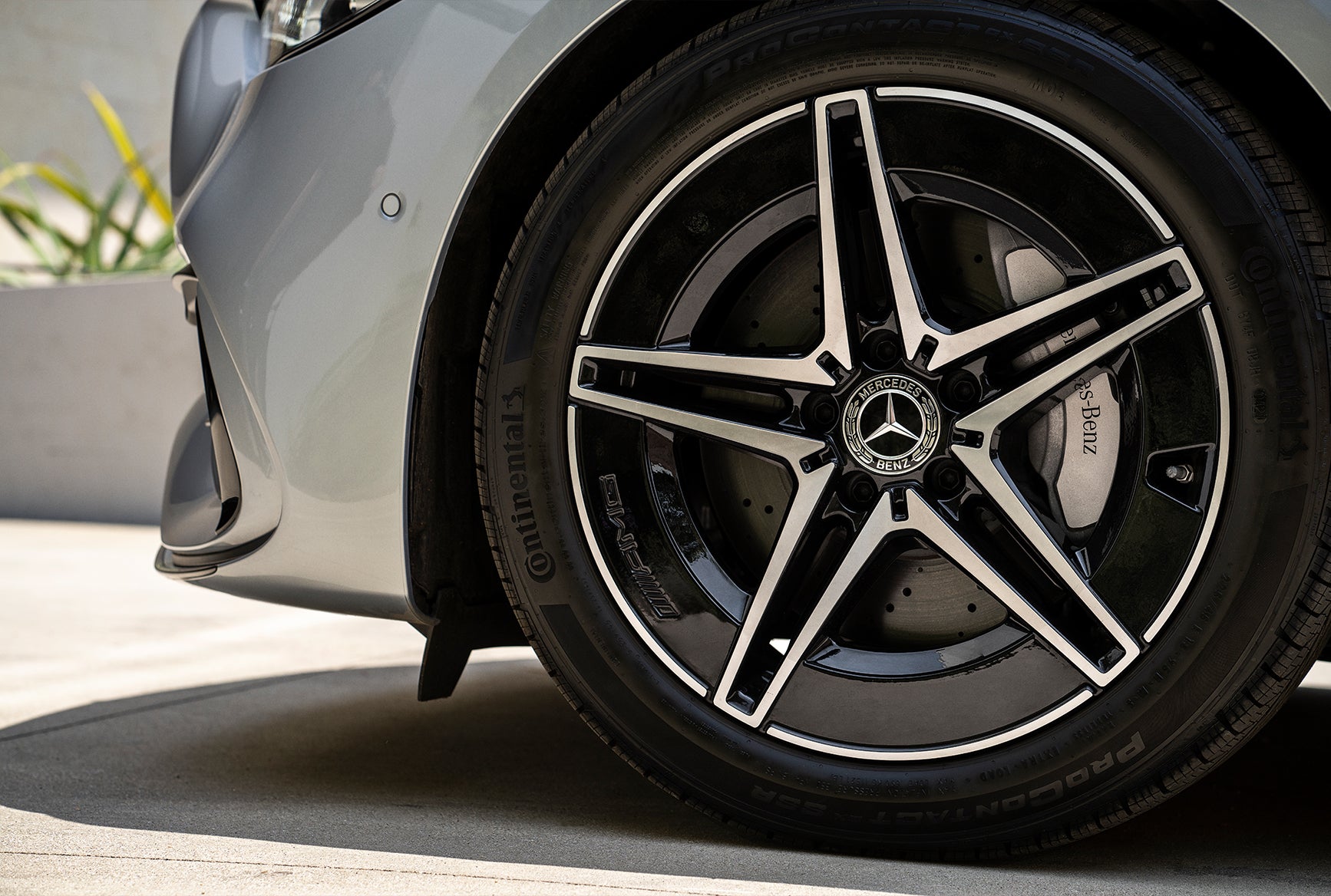 2027 Mercedes-Benz C-Class Sedan close-up of alloy wheel, tire, and brake detail.