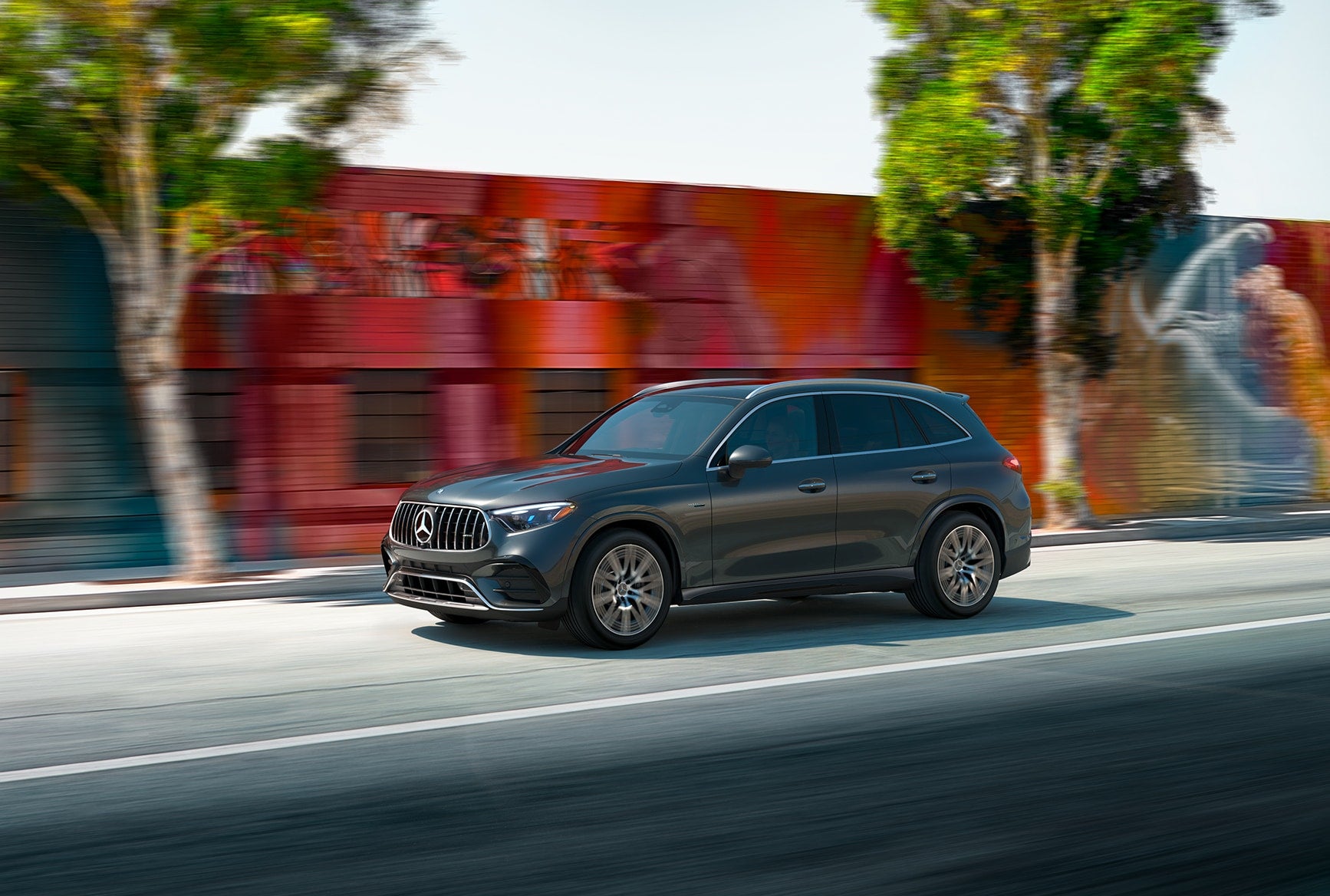 A Mercedes-Benz GLC cruises through the city, offering compact versatility for Chicagoland fall driving.