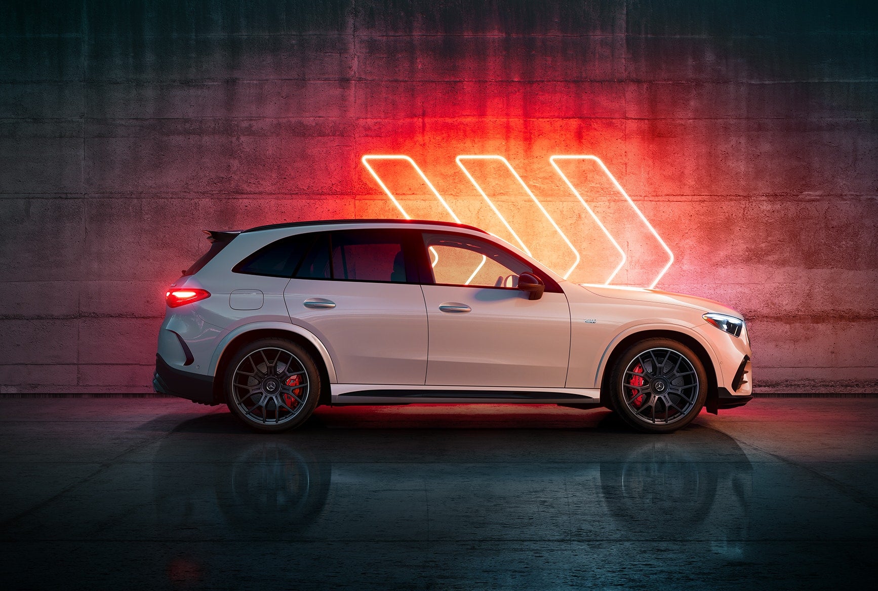 Side profile of the white 2027 Mercedes-AMG GLC 53 SUV with black wheels and red brake calipers.