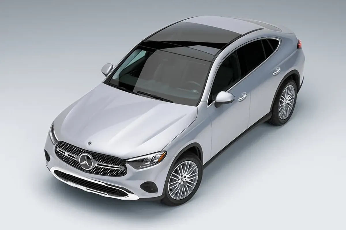 Mercedes-Benz GLC Coupe silver model, top-down angle highlighting panoramic roof and sleek body lines