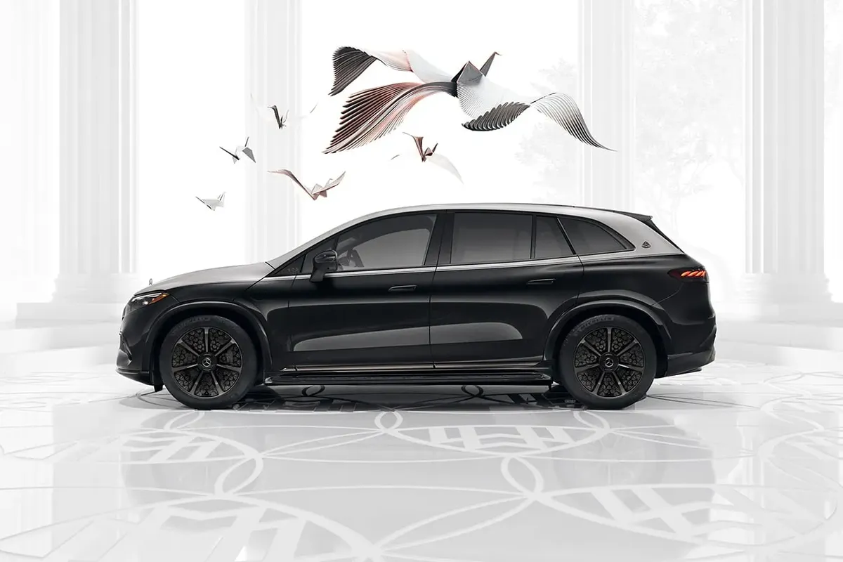 Mercedes-Maybach EQS SUV side view in elegant black finish with artistic backdrop.