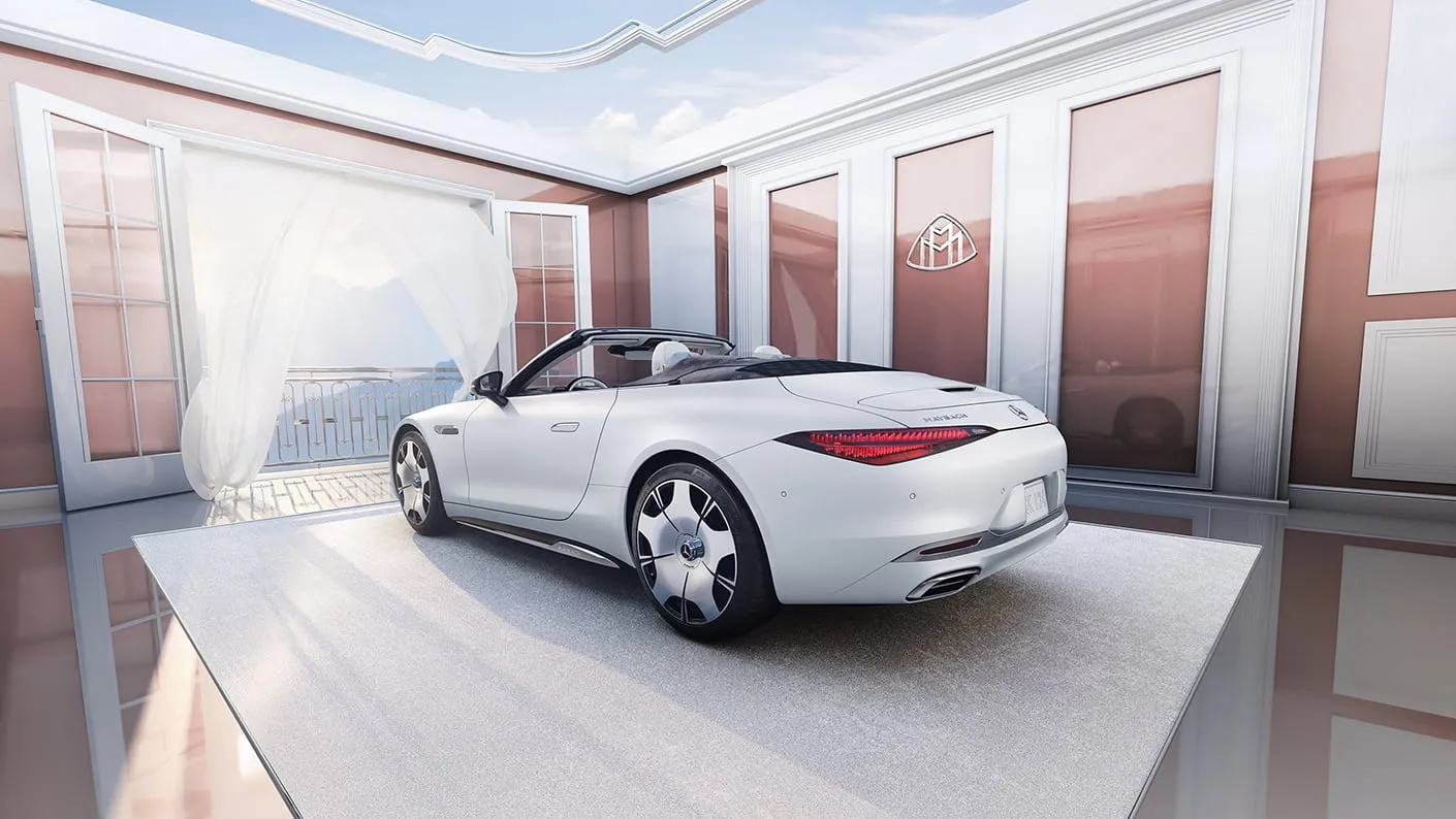 Rear three-quarter view of the Mercedes-Maybach SL Monogram convertible in white, embodying performance engineering and handcrafted elegance.