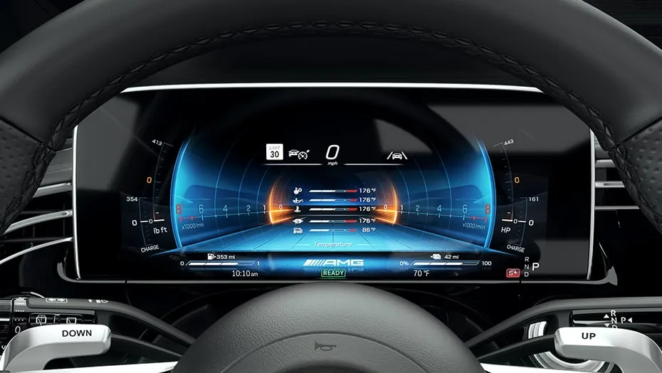 Mercedes-AMG E 53 Hybrid Wagon performance gauge cluster displaying AMG dynamic drive data and hybrid power output.