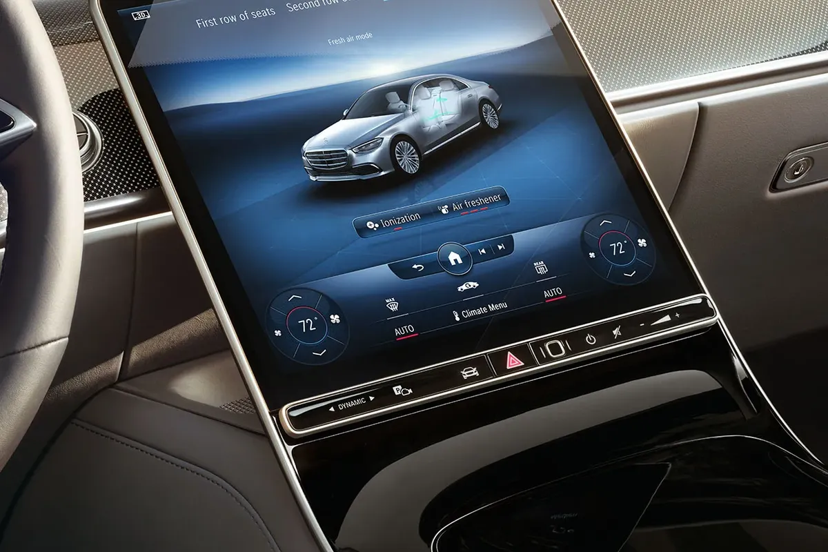 Central touchscreen interface of the Mercedes-Benz S-Class, featuring advanced digital climate and comfort controls.