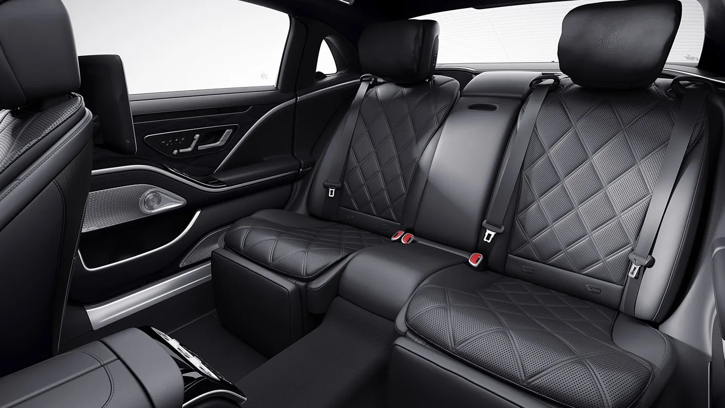 Mercedes-Maybach S-Class rear cabin with executive seating, quilted leather upholstery, and spacious passenger comfort