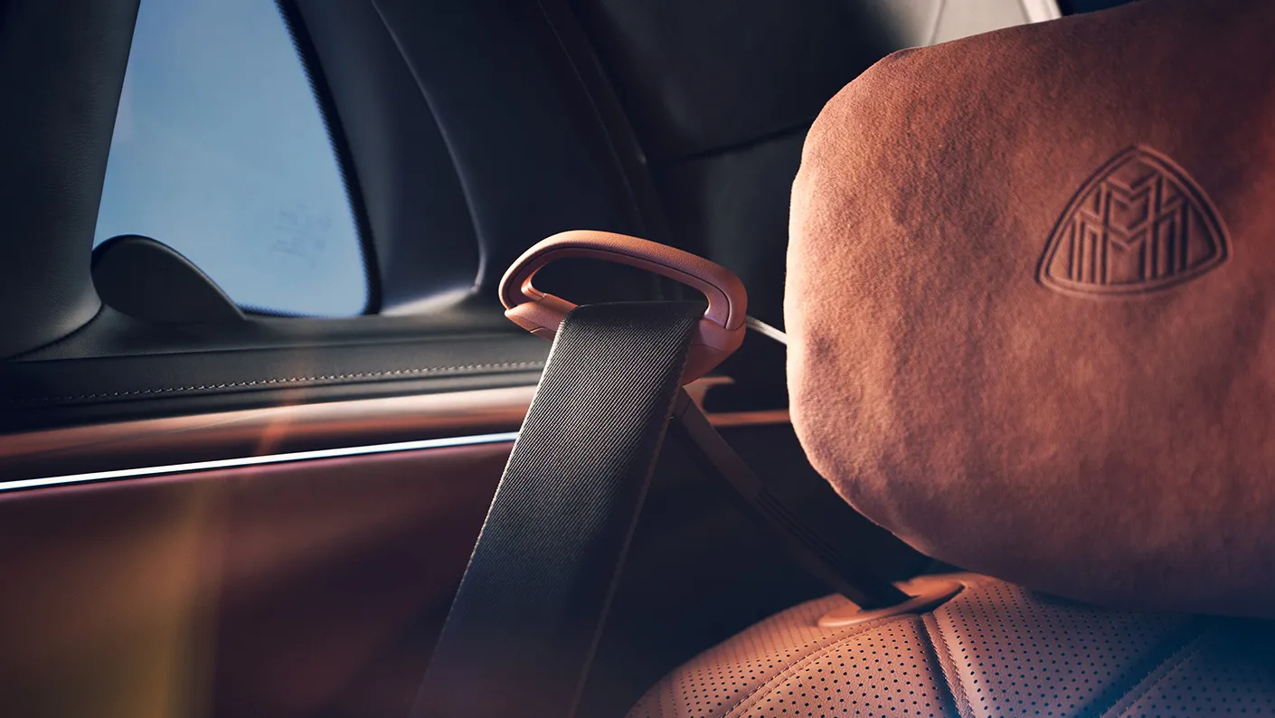 Close-up of Mercedes-Maybach S-Class handcrafted interior materials with embroidered headrest and premium leather finish