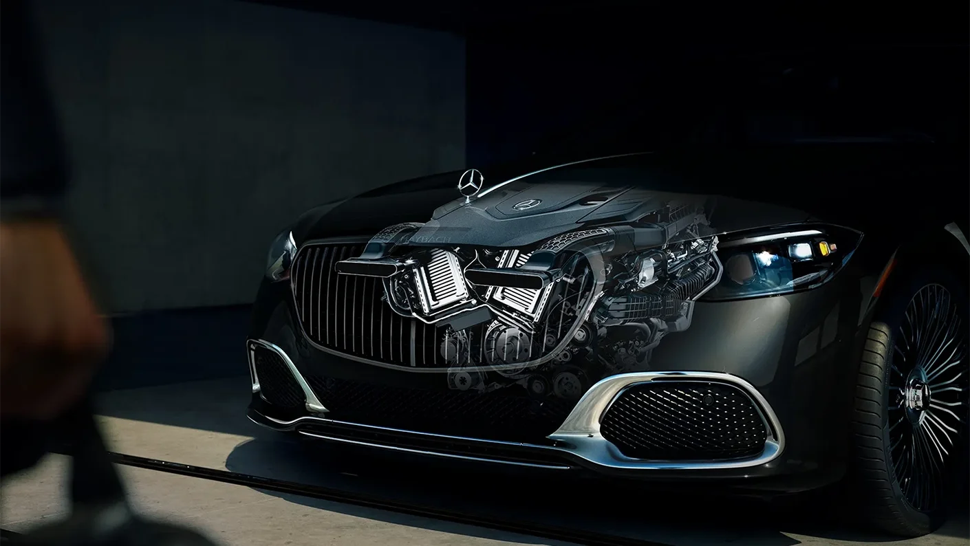 Front view of the Mercedes-Maybach S-Class with signature grille and illustration of its powerful luxury engine options