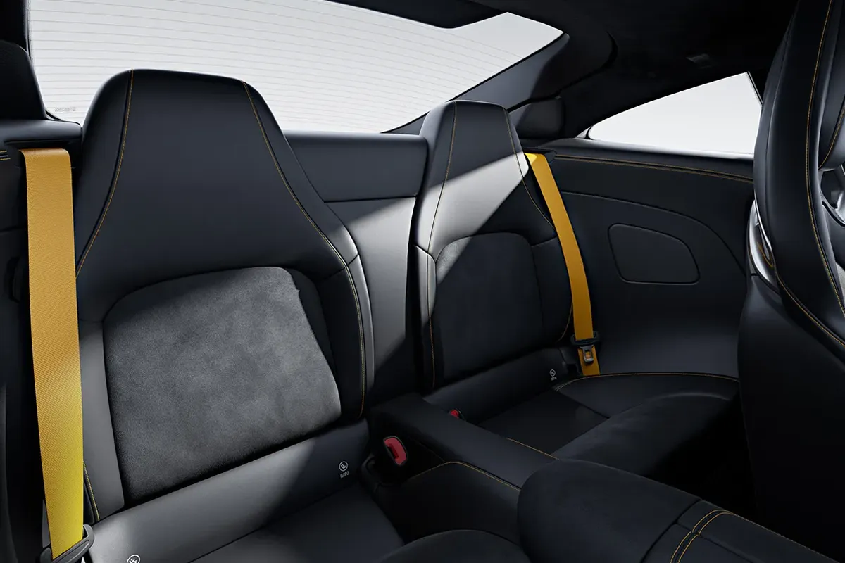 Rear seating area of the Mercedes-AMG GT showcasing high-luxury cabin materials.