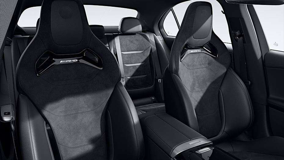 2027 Mercedes-Benz C-Class Electric black interior with AMG-style sport seats and rear passenger seating.