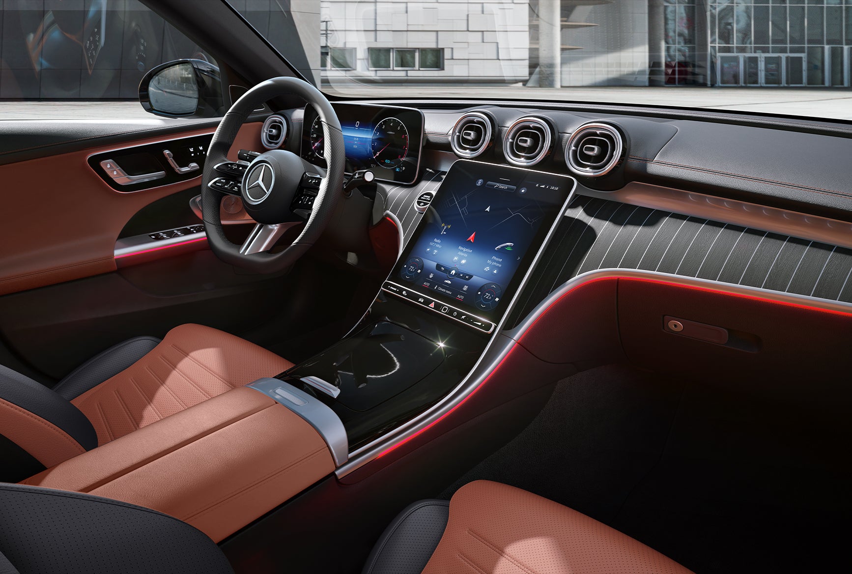 Mercedes-Benz C-Class luxury interior with touchscreen display, ambient lighting, and leather seats