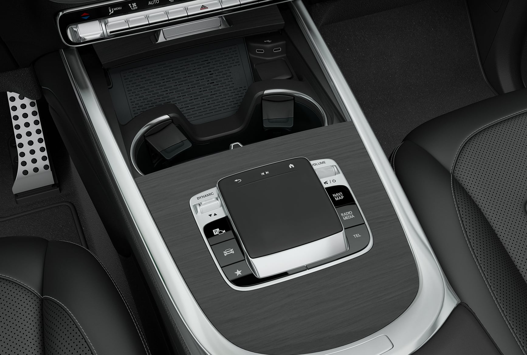 Mercedes-Benz G-Class interior center console with touchpad controls and premium materials.