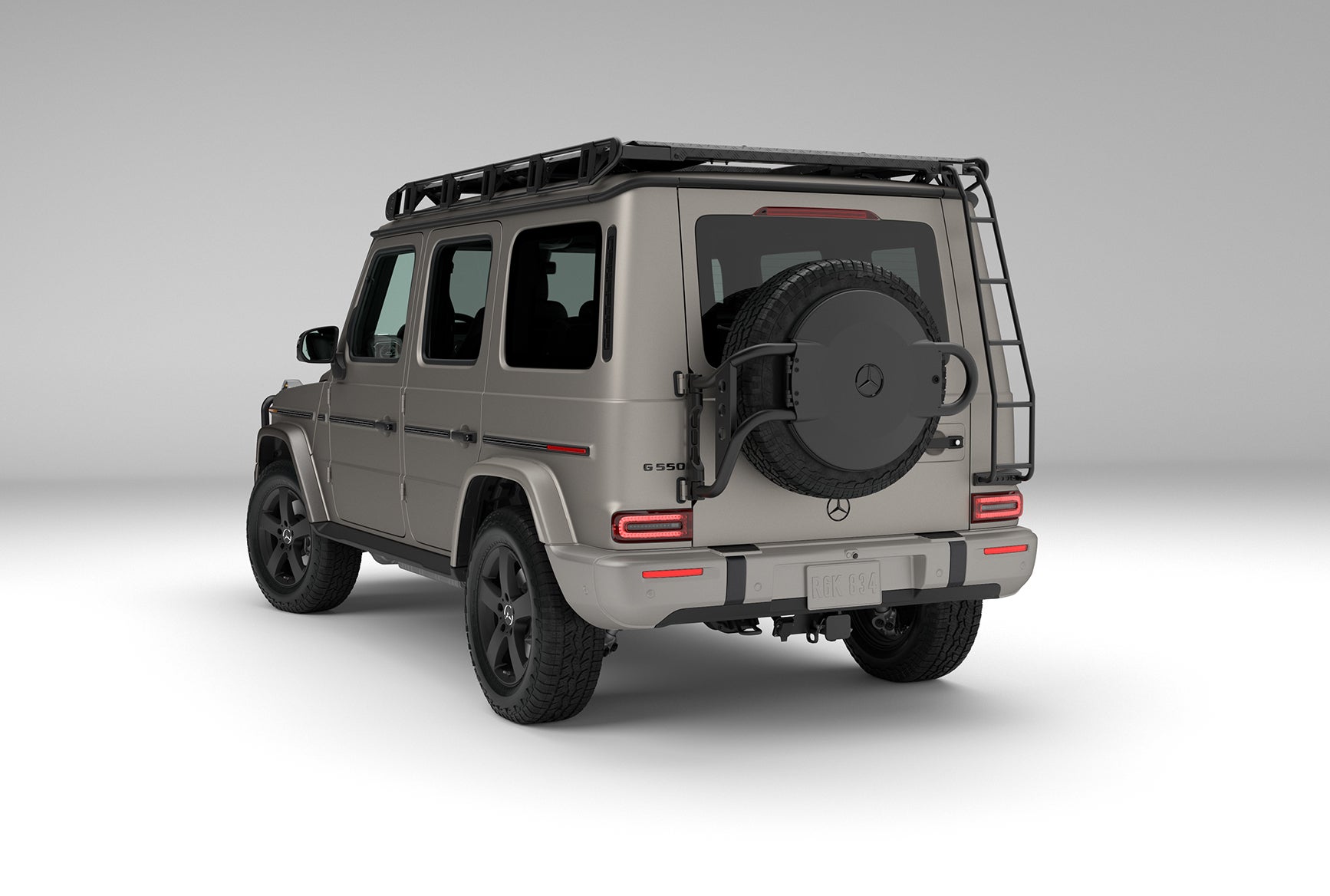Mercedes-Benz G-Class luxury SUV rear view with spare tire mounted on the tailgate and roof rack.