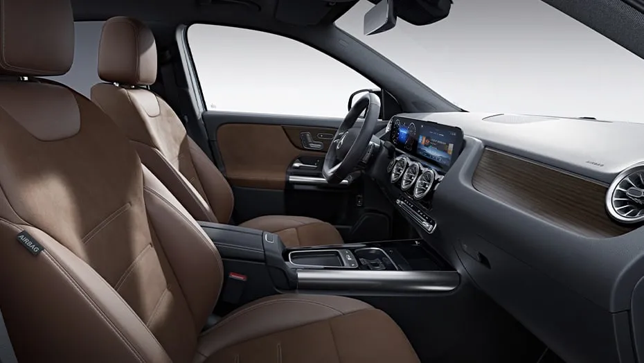 Mercedes-Benz GLA front interior with brown leather seats, wide digital screen, and premium cabin materials