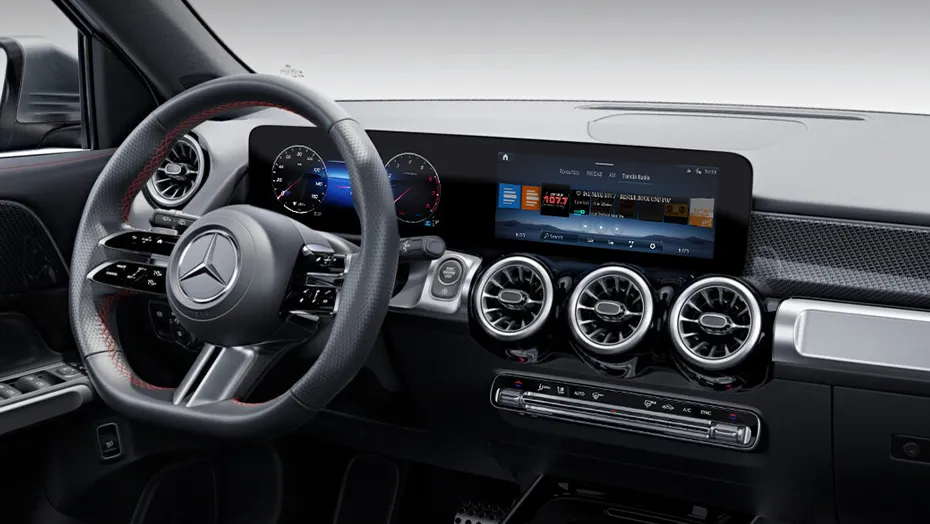 Mercedes-Benz GLB modern digital cockpit featuring widescreen display, steering wheel controls, and turbine-style air vents.
