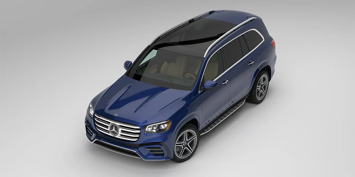 Blue Mercedes-Benz GLS seen from a high angle in a studio setting with a panoramic roof and chrome grille